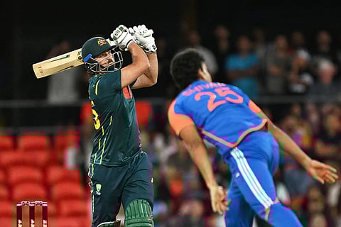 Australian batsman Tim David hits a six during a T20 cricket international between India and Australia in Carrara, Australia.
