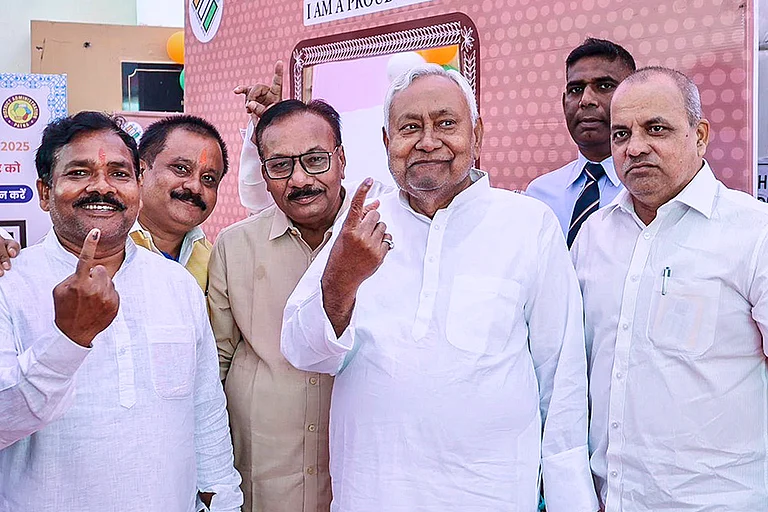 Bihar Chief Minister Nitish Kumar and others show their ink marked fingers after casting votes during the first phase of Bihar Assembly elections. - @NitishKumar/X & PTI
