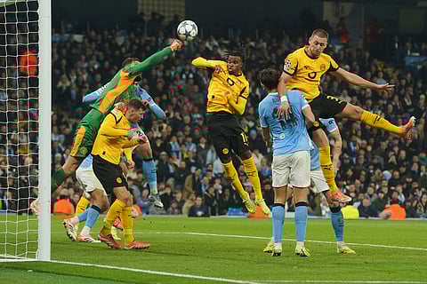 Manchester City's goalkeeper Gianluigi Donnarumma saves a ball during the Champions League opening phase soccer match between Manchester City and Borussia Dortmund in Manchester, England.