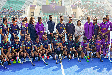 Union Minister for Sports Mansukh Mandaviya with Union Minister Kiren Rijiju and others poses with the players during the Hockey India centenary celebrations, at Major Dhyan Chand National Stadium, in New Delhi.