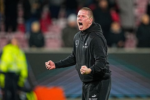 Midtjylland's head coach Mike Tullberg reacts after winning the Europa League soccer match between FC Midtjylland and Celtic FC in Herning, Denmark.