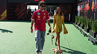 | Photo: AP/Moises Castillo : Ferrari driver Charles Leclerc of Monaco, girlfriend Alexandra Saint Mleux and their puppy Leo arrive for a practice session of the Formula One Mexico Grand Prix auto race at the Hermanos Rodriguez racetrack in Mexico City, Saturday, Oct. 25, 2025.