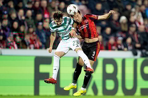Midtjylland's Han-Beom Lee, right, and Celtic's Sebastian Tounekti vie for the ball during the Europa League soccer match between FC Midtjylland and Celtic FC in Herning, Denmark.