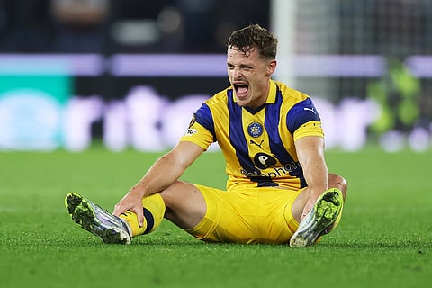 Maccabi Tel Aviv's Itamar Noy reacts during the Europa League soccer match between Aston Villa and Maccabi Tel Aviv in Birmingham, England.