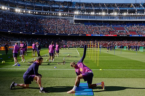 Barcelona's Lamine Yamal exercises during the team's first training session at the venue after its renovation at the Camp Nou stadium in Barcelona, Spain.
