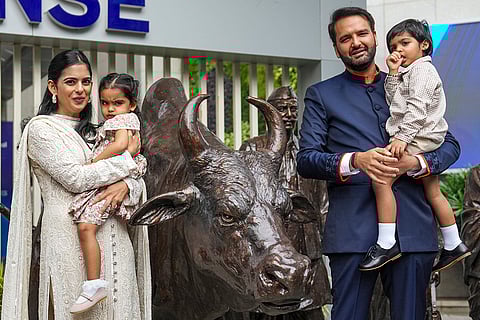 Piramal Finance Ltd. Executive Chairman Anand Piramal, right, with wife and Reliance Industries Non-Executive Director Isha Ambani, left, and their children during the listing of Piramal Finance on the National Stock Exchange (NSE), in Mumbai.