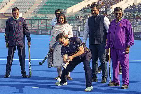 Union Minister Kiren Rijiju tries his hand at hockey as Union Sports Minister Mansukh Mandaviya and others look on during the Hockey India centenary celebrations, at Major Dhyan Chand National Stadium, in New Delhi.