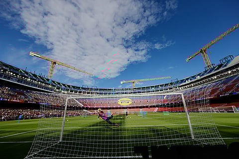 Barcelona's players exercise during the team's first training session at the venue after its renovation at the Camp Nou stadium in Barcelona, Spain.