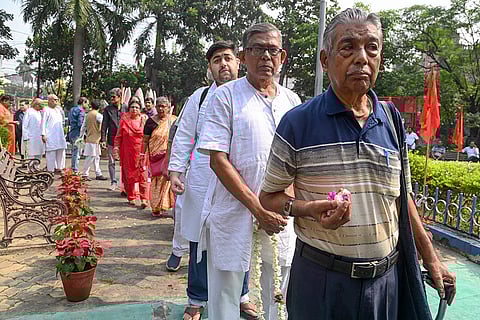 Members of the Left Front wait in a queue to pay tribute to Vladimir Lenin to mark the anniversary of Russia's 'November Revolution', in Kolkata.