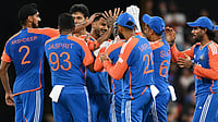 Dave Hunt/AAPImage via AP : Axar Patel, centre, is congratulated by teammates after dismissing Matt Short during the fourth T20I between India and Australia in Carrara.
