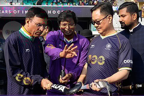 Union Minister for Sports Mansukh Mandaviya with Union Minister Kiren Rijiju and others during the Hockey India centenary celebrations, at Major Dhyan Chand National Stadium, in New Delhi.