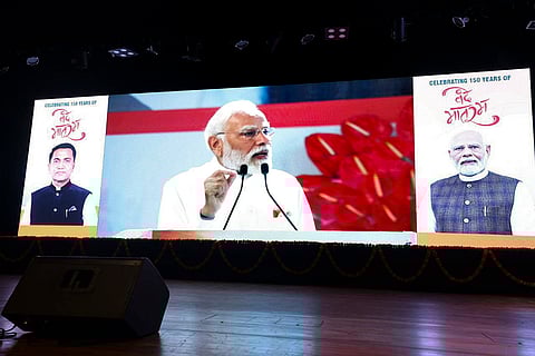 Prime Minister Narendra Modi's address being telecasted during an event to mark 150 years of the national song 'Vande Mataram', at Kala Academy, in Panaji, Goa. 