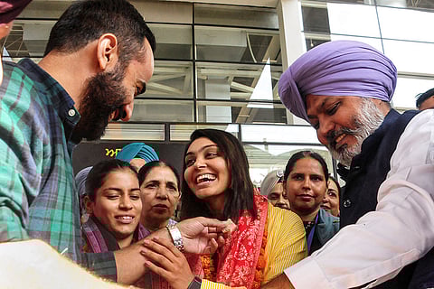 Amanjot Kaur and Harleen Deol, members of the Women's ODI World Cup 2025-winning Indian cricket team, being welcomed by AAP MP Gurmeet Singh Meet Hayer and Punjab minister Harpal Singh Cheema upon their arrival in Mohali, Punjab.