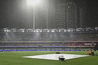 India Vs Australia, 5th T20I: See Best Photos From The Gabba | Photo: Darren England/AAPImage via AP : Rain falls during a T20 cricket international between India and Australia in Brisbane, Australia.