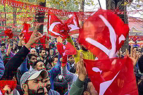 Jammu and Kashmir National Conference (JKNC) workers and supporters during a rally attended by party Vice President and state Chief Minister Omar Abdullah, unseen, ahead of the Budgam Assembly constituency bypoll, in Budgam district, Jammu and Kashmir.