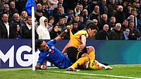 AP/John Walton : Malo Gusto (left) and Wolverhampton Wanderers' Hwang Hee-Chan battle for the ball during the English Premier League soccer match.