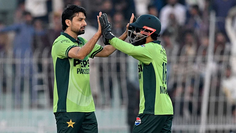 Abrar Ahmed celebrates a wicket with Mohammad Rizwan - null