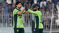 Abrar Ahmed celebrates a wicket with Mohammad Rizwan
