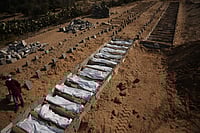 AP Photo/Abdel Kareem Hana : Bodies of unidentified Palestinians returned from Israel as part of the ceasefire deal are buried in a mass grave in Deir al-Balah, Gaza Strip, Wednesday, Nov. 5, 2025. 