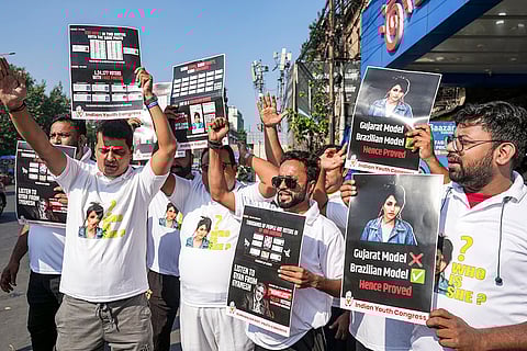 Congress supporters raise slogans during a protest under the 'Vote Chor, Gaddi Chhod' (vote thieves, quit power) campaign, in Kolkata.