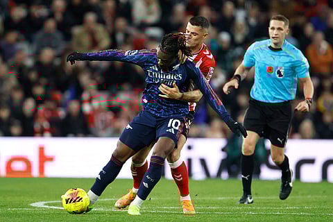 Arsenal's Eberechi Eze (left) and Sunderland's Granit Xhaka battle for the ball during the English Premier League soccer match between Arsenal and Sunderland, in Sunderland, England.