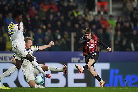AC Milan's Alexis Saelemaekers, right, scores a goal during the Serie A soccer match between Parma and AC Milan in Parma, Italy. 