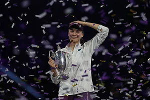 | Photo: AP/Fatima Shbair : Elena Rybakina of Kazakhstan celebrates with her trophy after defeating Aryna Sabalenka of Belarus in the women's final singles match of the WTA finals in Riyadh, Saudi Arabia.