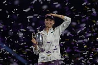 2025 WTA Finals: Rybakina Stuns Sabalenka In Riyadh To Win Title | Photo: AP/Fatima Shbair : Elena Rybakina of Kazakhstan celebrates with her trophy after defeating Aryna Sabalenka of Belarus in the women's final singles match of the WTA finals in Riyadh, Saudi Arabia.