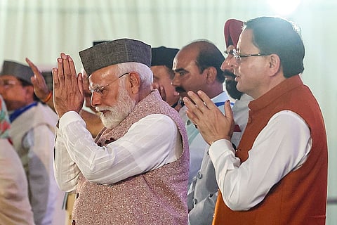 Prime Minister Narendra Modi, left, and Uttarakhand Chief Minister Pushkar Singh Dhami during the inauguration and foundation stone laying of various projects on the occasion of ‘Uttarakhand Formation Day’, in Dehradun. 