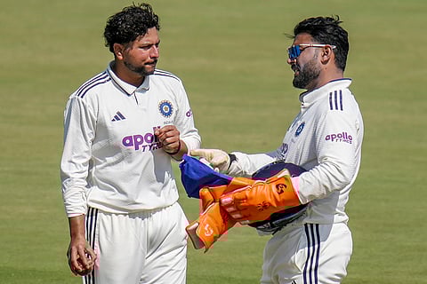 India A's captain Rishabh Pant, right, interacts with Kuldeep Yadav on day four of the second unofficial four-day Test cricket match of a series between India A and South Africa A, at BCCI Centre of Excellence, in Bengaluru, Karnataka.