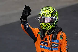 | Photo: AP/Andre Penner : McLaren driver Lando Norris of Britain celebrates finishing first during the qualifying session ahead of the Brazilian Formula One Grand Prix at the Interlagos race track, in Sao Paulo.