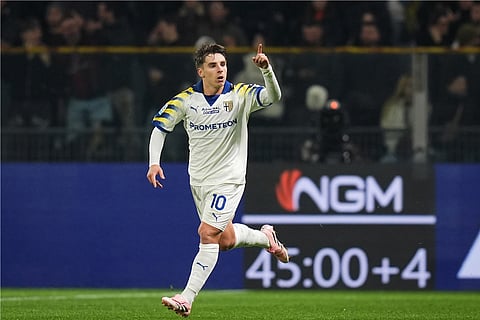 Parma's Adrian Bernabe celebrates after scoring during the Serie A soccer match between Parma and Milan in Parma, Italy.