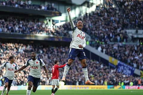 Tottenham's Wilson Odobert, centre, celebrates after Tottenham's Richarlison scored his side's second goal during the English Premier League soccer match between Tottenham Hotspur and Manchester United in London, England.