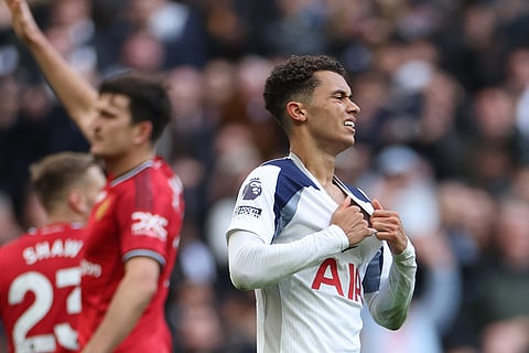 Tottenham's Brennan Johnson reacts after missing a scoring chance during the English Premier League soccer match between Tottenham Hotspur and Manchester United in London, England.