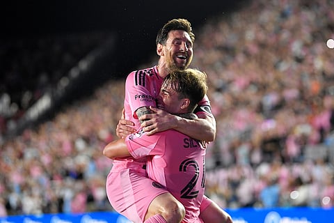 Inter Miami forward Lionel Messi, top, celebrates with forward Mateo Silvetti, bottom, after scoring during the first half of Game 3 in the first round of MLS soccer's Western Conference playoffs against Nashville SC in Fort Lauderdale, Florida.