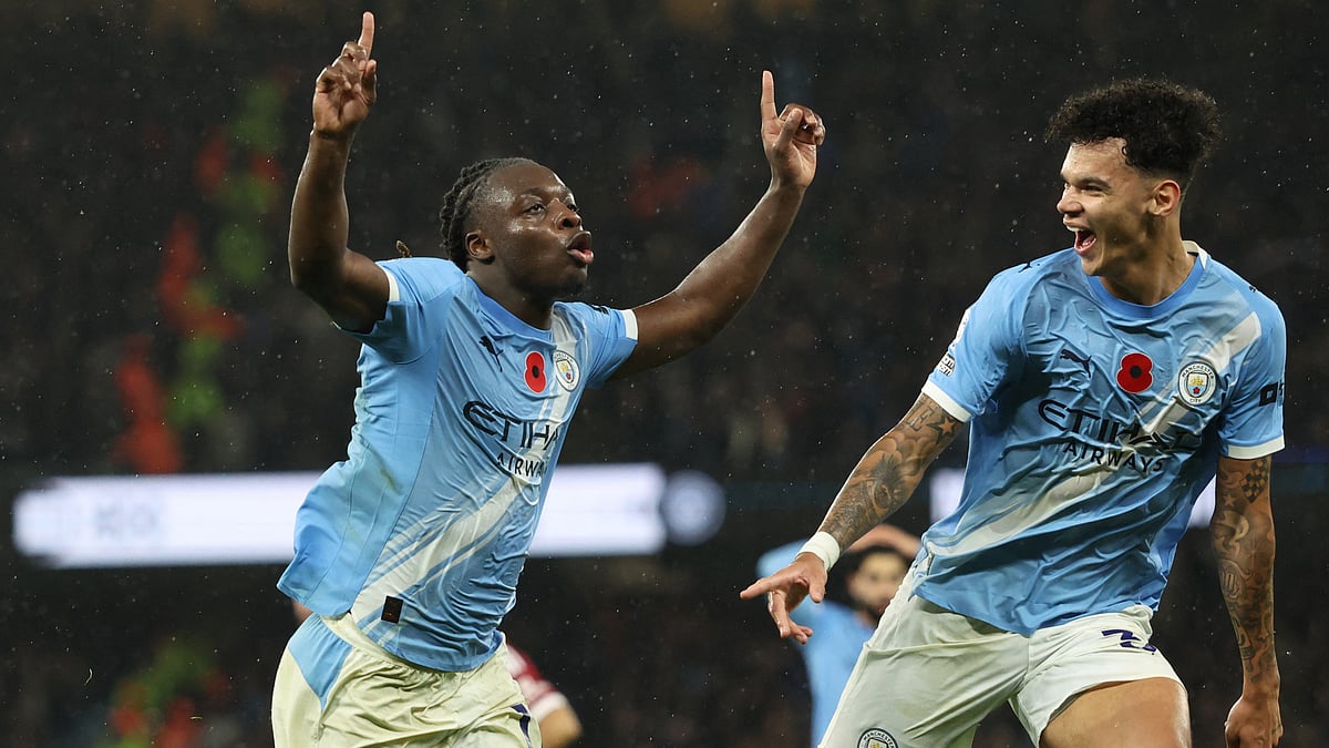 Jeremy Doku celebrates after scoring Manchester City's third goal - null