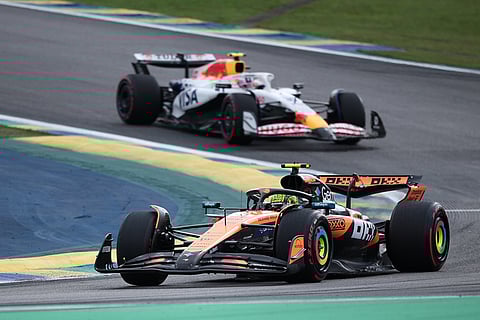 McLaren driver Lando Norris of Britain, front, drives during the qualifying session ahead of the Brazilian Formula One Grand Prix at the Interlagos race track, in Sao Paulo.