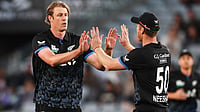 AP | Chris Symes                     : New Zealand's Kyle Jamieson, left, is congratulated by teammate Jimmy Neesham after taking the wicket
