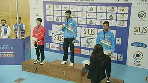 ISSF YouTube channel : India's Samrat Rana (centre) and Varun Tomar (right) at the podium with their medals from the men's 10m air pistol final of the ISSF World Championships.