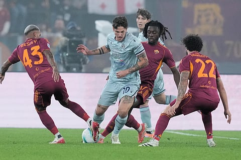 Roma's Wesley, left, challenges Udinese's Nicolo Zaniolo during the Serie A soccer match between Roma and Udinese, in Rome.