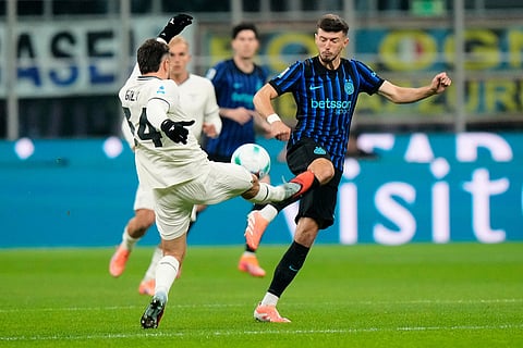 Inter Milan's Petar Sucic, right, is challenged by Lazio's Mario Gila during a Serie A soccer match between Inter Milan and Lazio, in Milan, Italy.