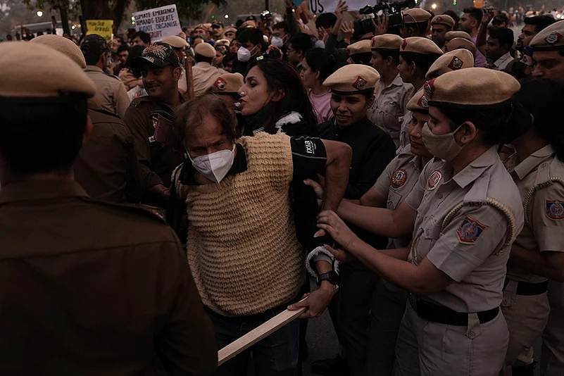 Police detain activists during the protest on Sunday