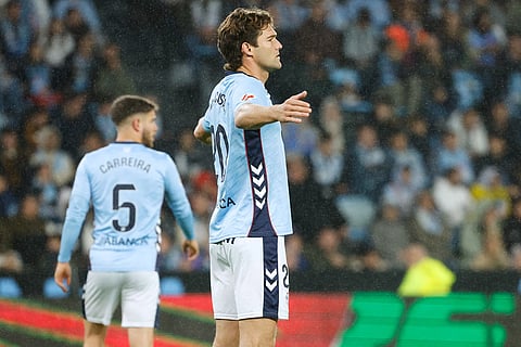 Celta's Marcos Alonso protests to referee after he awards a penalty to Barcelona during the Spanish La Liga soccer match between Celta Vigo and Barcelona in Vigo, Spain.