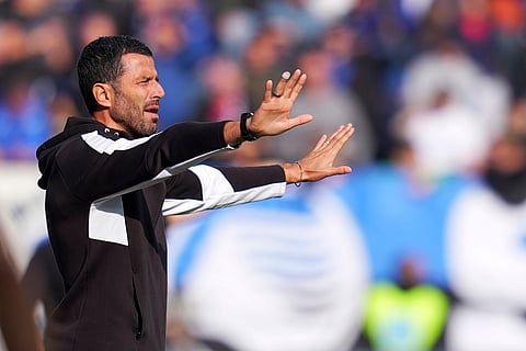 Sassuolo's head coach Fabio Grosso gives indications to his players during a Serie A soccer match between Atalanta and Sassuolo, in Bergamo, northern Italy.