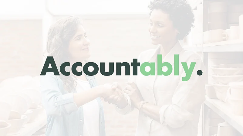 An image of two people shaking hands with the word Accountably in bold text