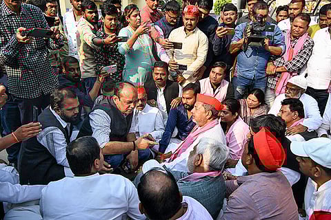 Samajwadi Party MP Virendra Singh stages a protest after he was allegedly stopped from visiting Dalmandi area, where a demolition drive is underway as part of a road-widening project, in Varanasi.