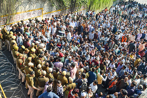 Members of the Public Health Engineering (PHE) Employees United Front stage a protest demanding regularisation of their services by the state government, in Jammu.