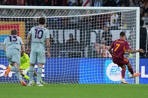 Roma's Lorenzo Pellegrini scores during the Serie A soccer match between Roma and Udinese, in Rome.