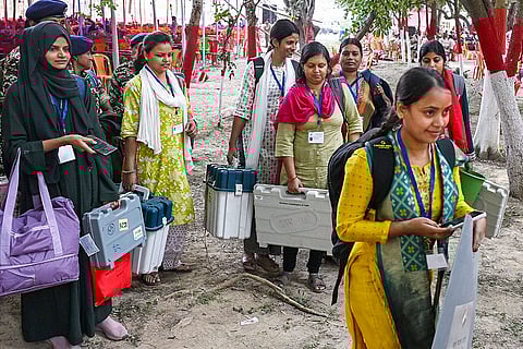 Polling officials carrying election material leave for their respective polling booths, a day before the second and final phase of Bihar Assembly elections, in Jehanabad.