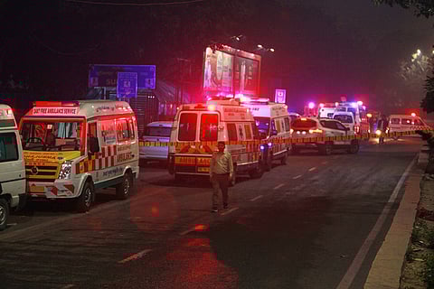 Ambulances are lined up at the scene after a car explosion near the historic Red Fort in New Delhi.
